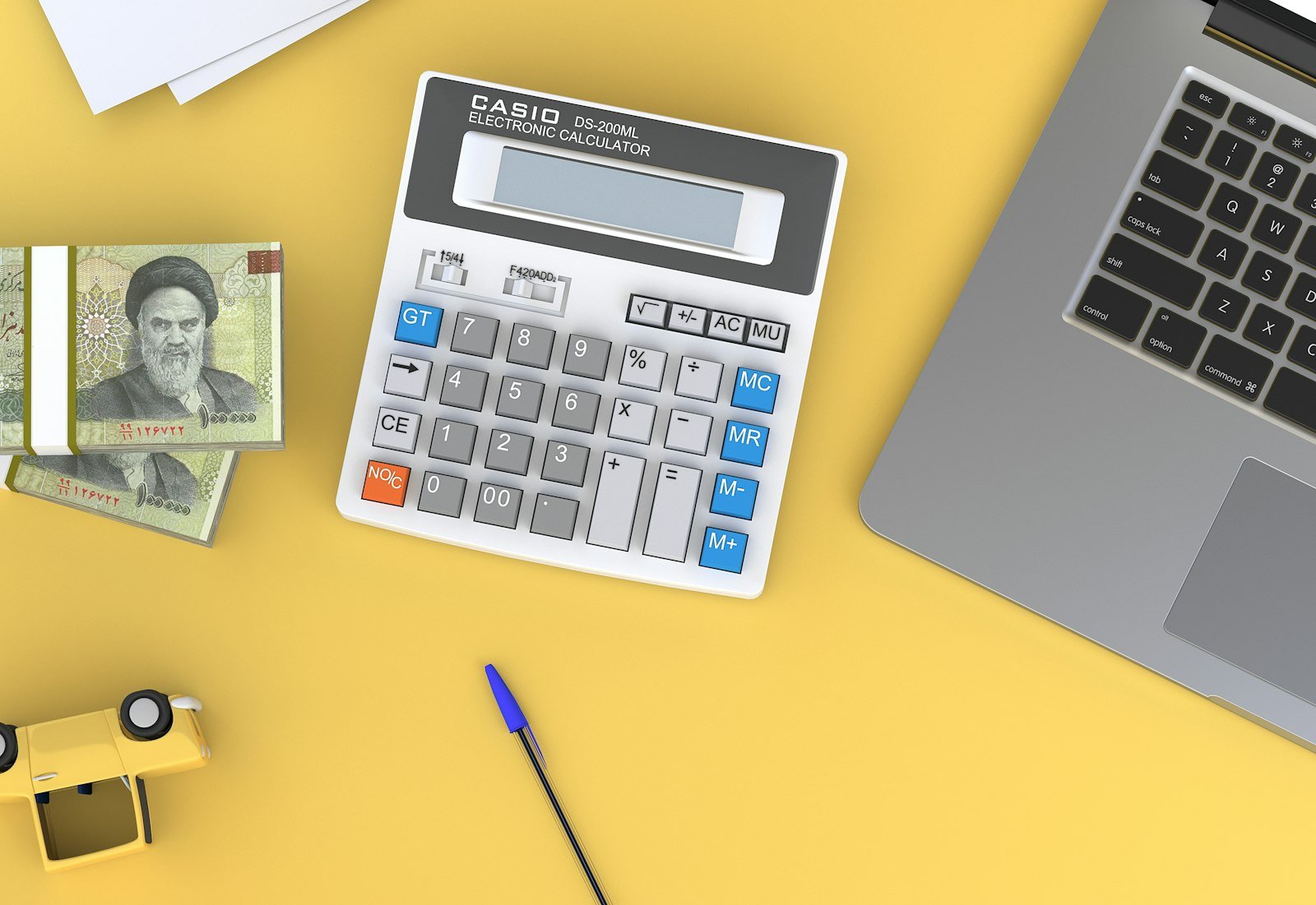 Calculator and property finance documents on a desk