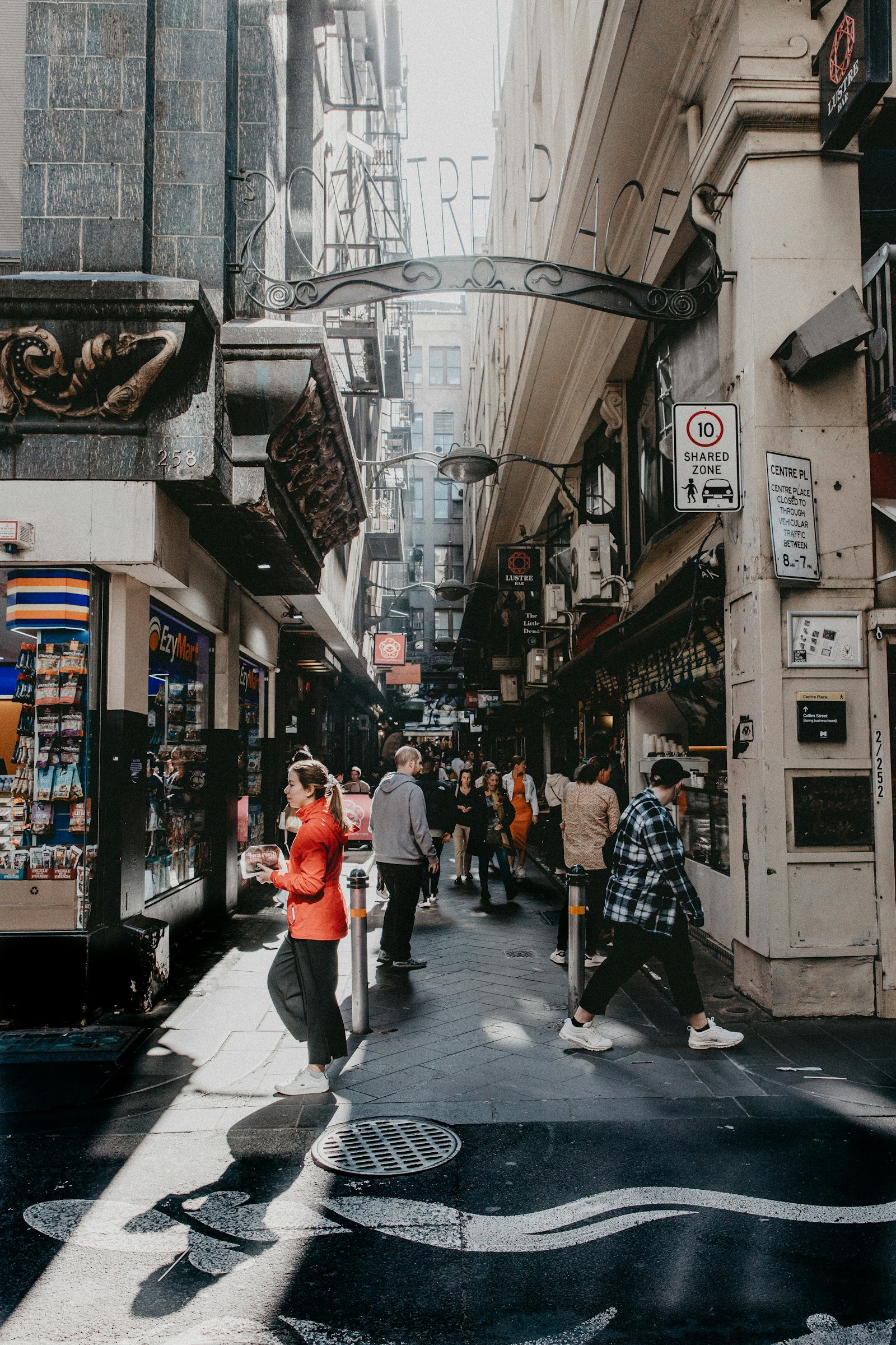 Busy Melbourne retail street with pedestrians
